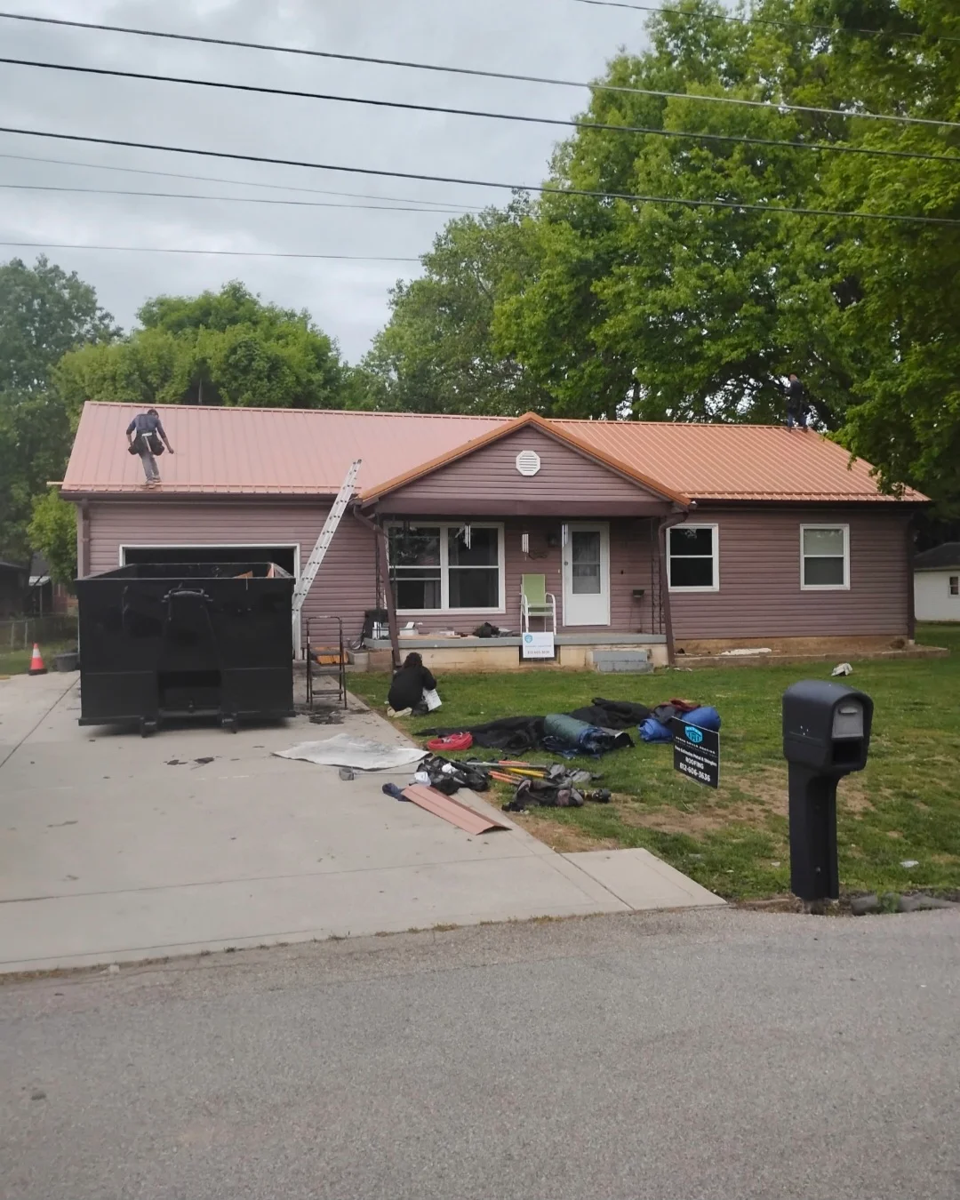 Copper metal roof installation on residential home with standing seam panels